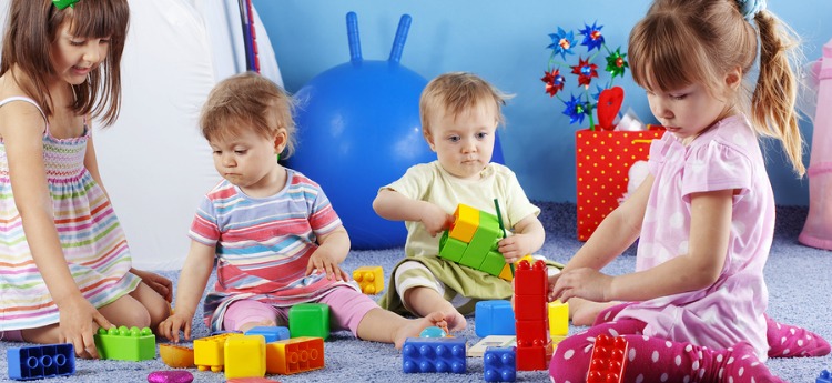 Group of kids playing with constructor