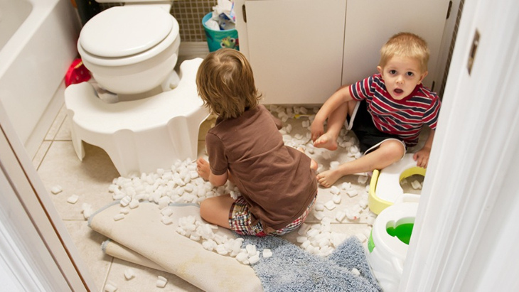 Naughty kids making mess in the bathroom